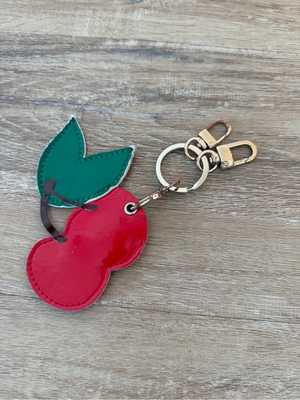 Sonix Red Cherry AirTag Keychain with Green Leaves